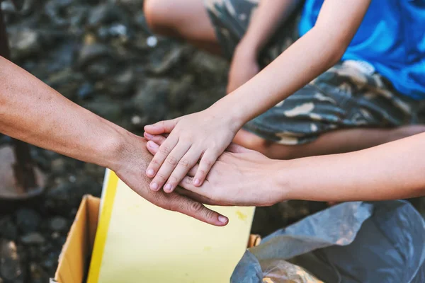 Close up volunteer teamwork join hands in environment conservation ,Volunteering world environment day.