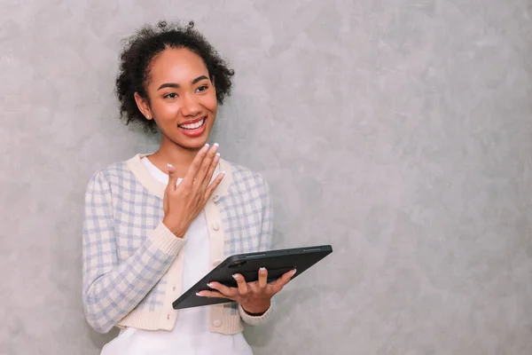 Portrait woman business using laptop for work, beauty black african american ,Isolated on gray background