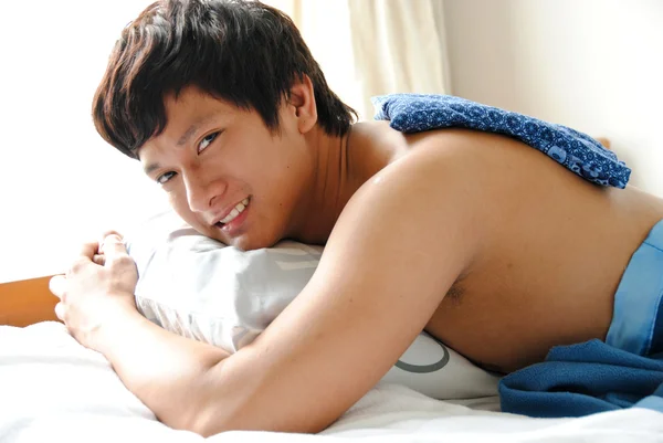 Asian men relaxing in pillow — Stock Photo, Image