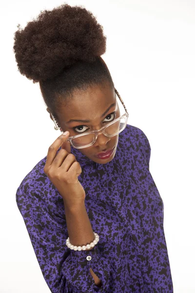 African american woman looks over her glasses — Stock Photo, Image