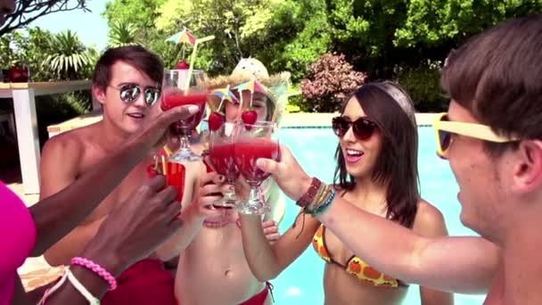 Friends toasting at swimming pool — Stock Video