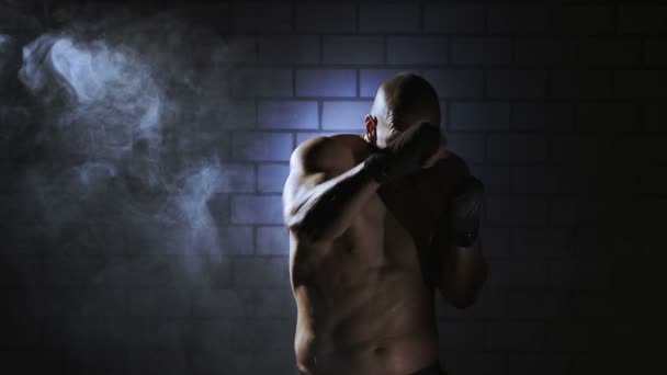 Kickboxer shadow boxing as exercise for the big fight — Stok Video