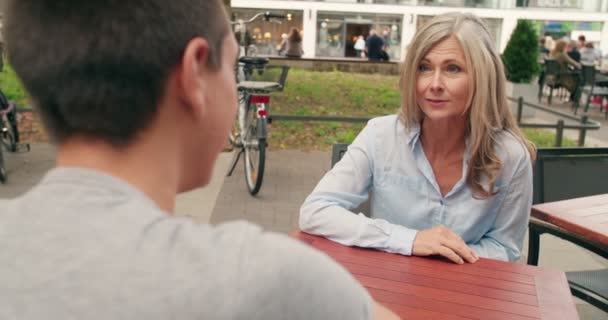 Smiling Mature Woman Enjoying Cup Coffee Outdoor Cafe Young Man — Stock Video