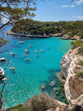 View of turquoise sea in beautiful bay Cala Mitjaneta in Menorca Spain