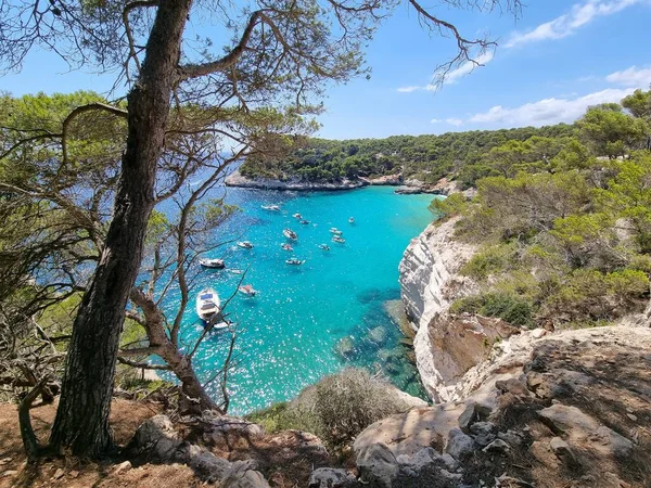 View of turquoise sea in beautiful bay Cala Mitjaneta in Menorca Spain