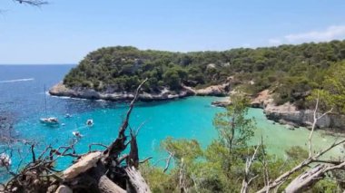 View of turquoise sea in beautiful bay Cala Mitjaneta in Menorca Spain. High quality 4k footage