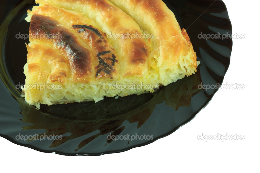 Piece of pie on a black plate