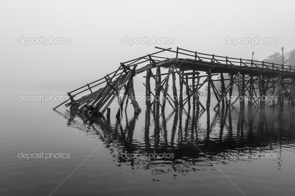 A broken down wooden bridge 