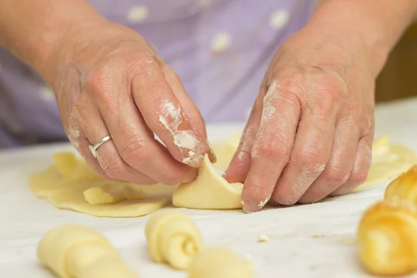 Baker making mini croissants, close up — Stock Photo, Image