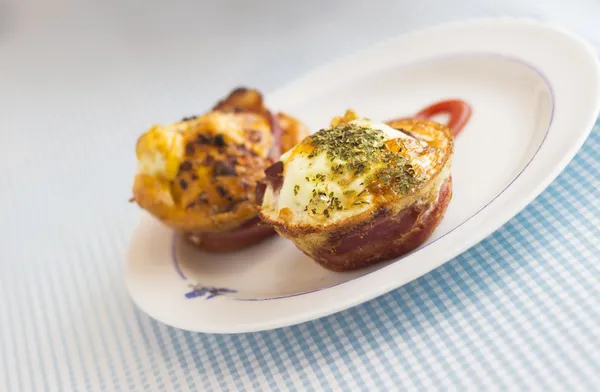 Paleo frukost - bacon och ägg muffins Royaltyfria Stockbilder