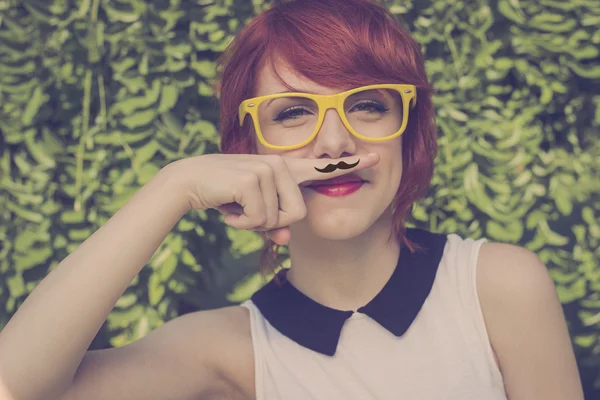 Cute hipster teenage girl with mustache, retro styled imagery — Stock Photo, Image