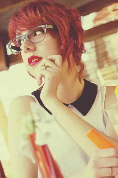 Cute hipster girl in a coffee shop — Stock Photo, Image