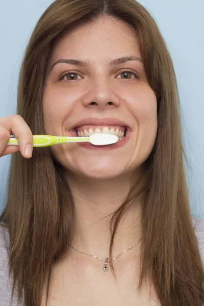 Beautiful woman brushing teeth Stock Photo