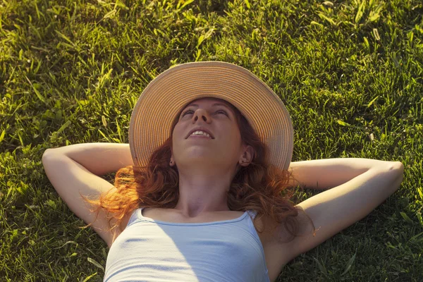 Lying in the grass — Stock Photo, Image