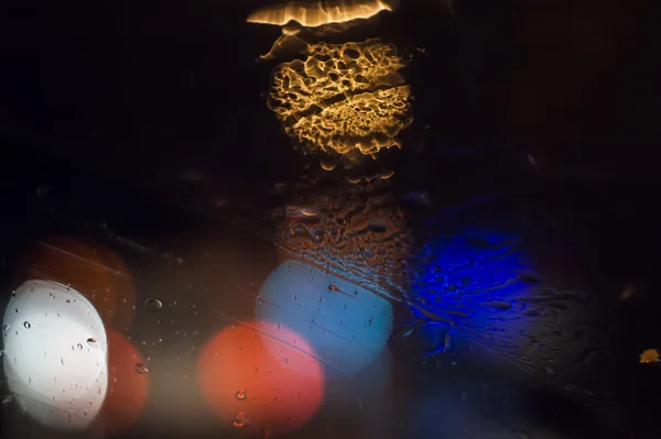 Bokehs en la noche y bajo la lluvia — Foto de Stock