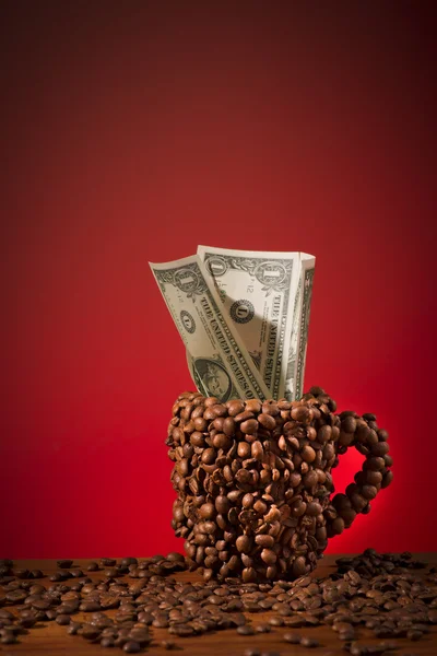 Cup of coffee beans Royalty Free Stock Images