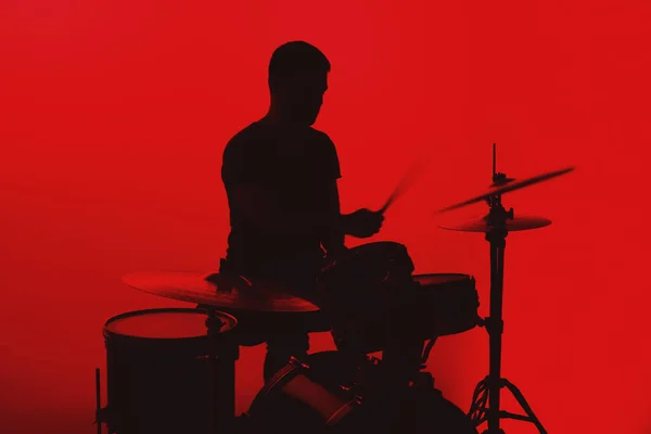 Silhouette Young Man Playing Drums Red Background — Stockfoto