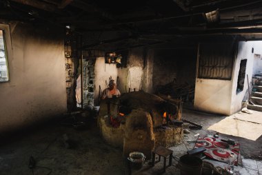 Izmir, Turkey - September 1, 2021: One man is working in Amulet and Evil Eye bead production workshop.