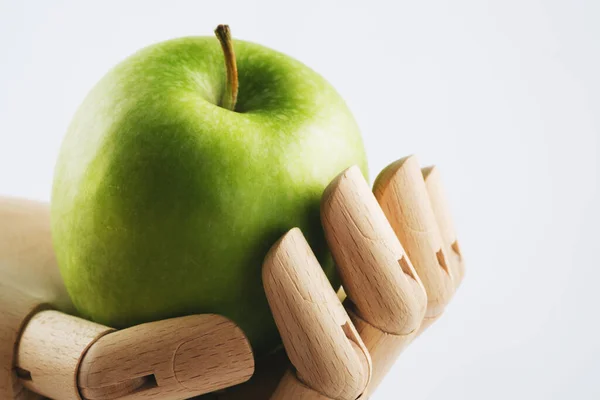 Wooden Hand Holding Granny Smith Apple White Background — Stock Photo, Image