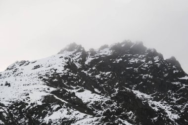 Landscape View of snowy mountains and hills from train trip and in central anatolia in winter.