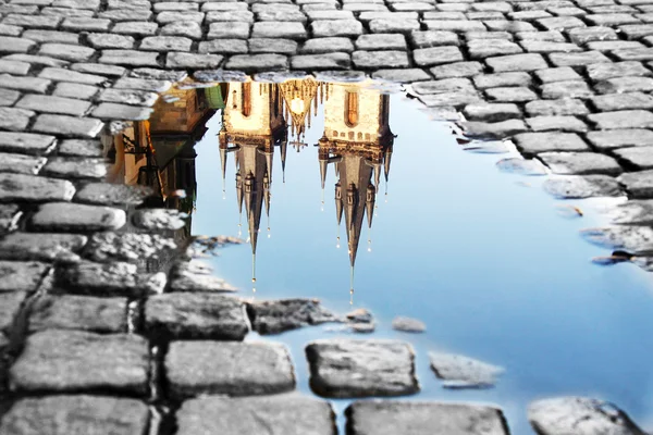 Puddle on the Old Town Square Royalty Free Stock Photos
