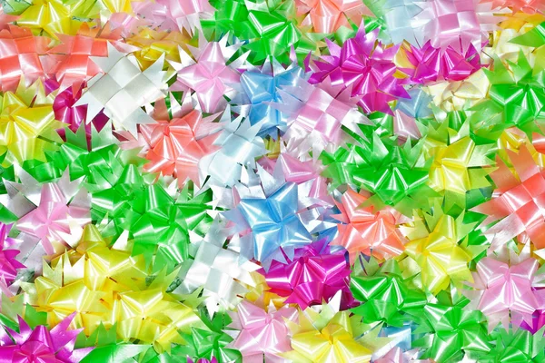Las cintas de colores tejen en forma de flor . — Foto de Stock