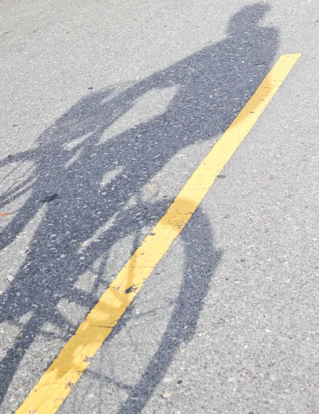 Schaduw van een man fietsten — Stockfoto