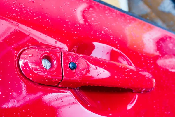 Maçaneta da porta do carro vermelho — Fotografia de Stock