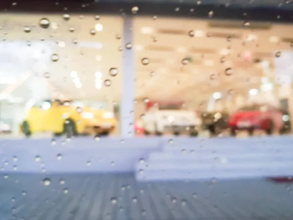 Blurred Showroom Car Looking Rain Drop Glass Background Use — Stock Photo, Image