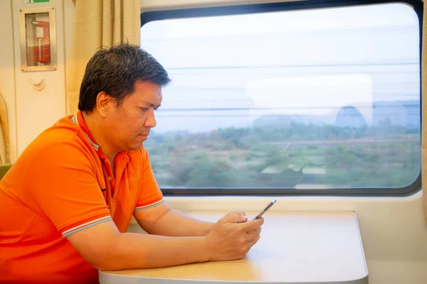 Asian Man Using Mobile Phone Train — Stock Photo, Image