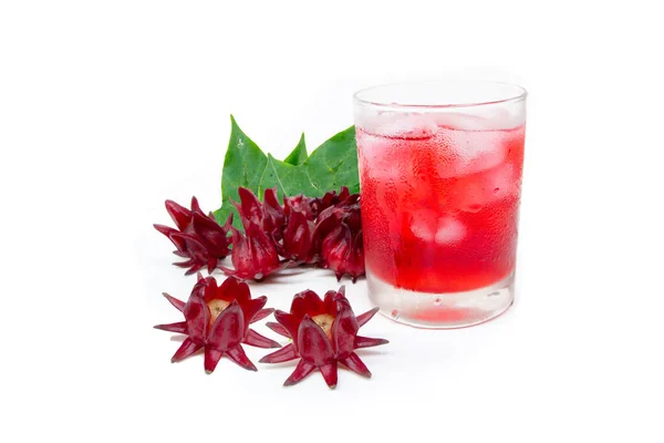 アイスとドライローゼルフルーツの花と緑の葉でガラスのローゼルジュース 健康飲料 ロイヤリティフリーのストック写真