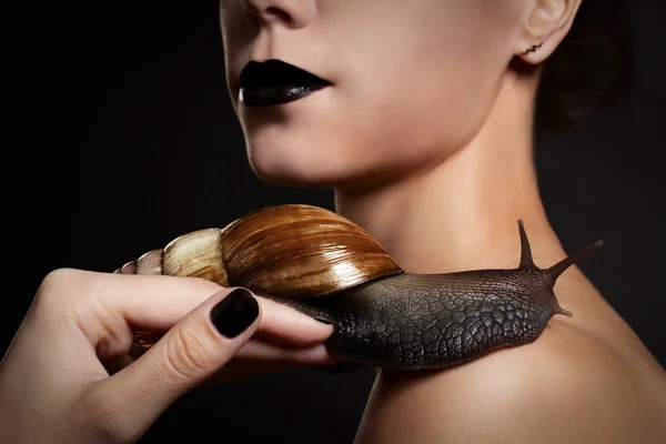 Woman with snail. Fashion. Gothic — Stock Photo, Image