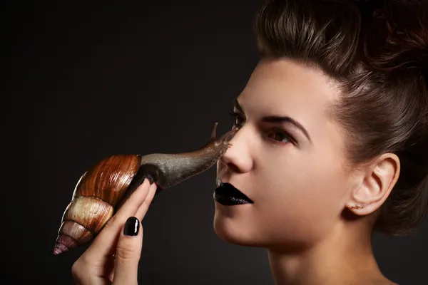 Woman with snail on the nose. Fashion. Gothic — Stock Photo, Image