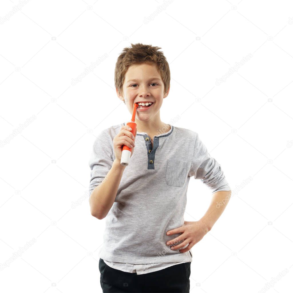 handsome smiling boy with toothbrush isolated on white background.