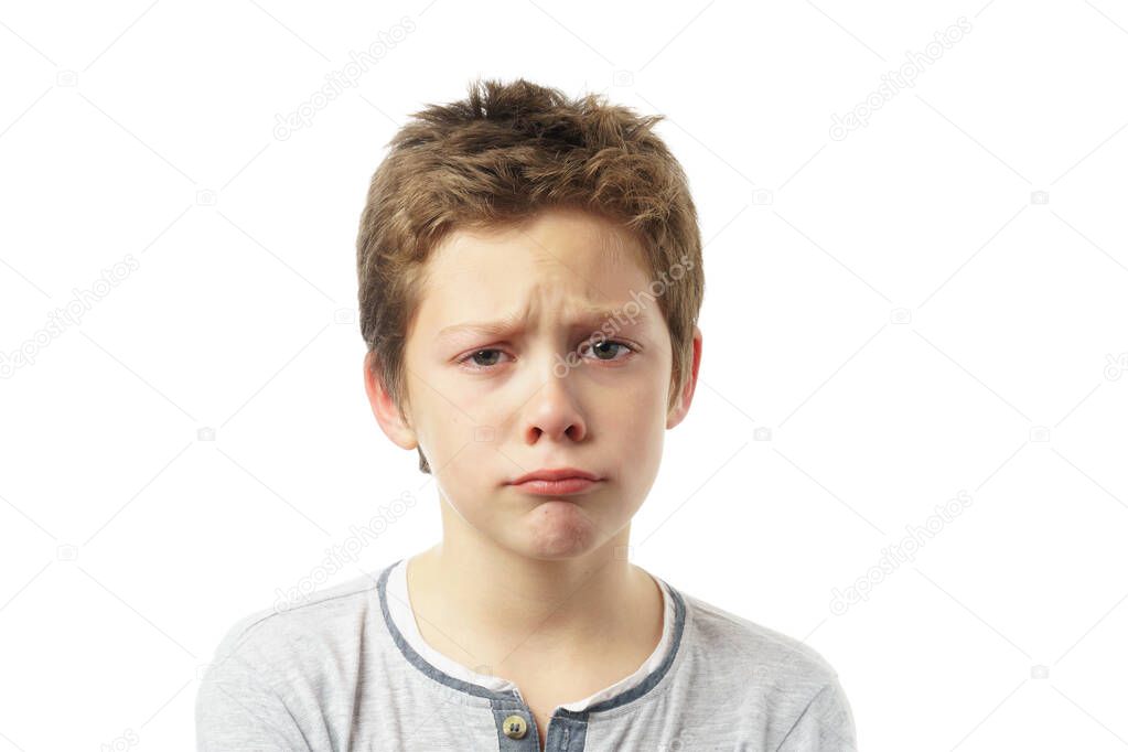 portrait of angry cute boy isolated on white background