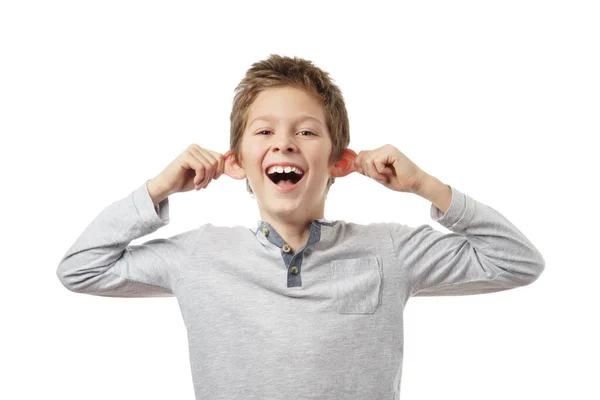 Freudiger Junge Der Seine Ohren Isoliert Auf Weißem Hintergrund Hält — Stockfoto
