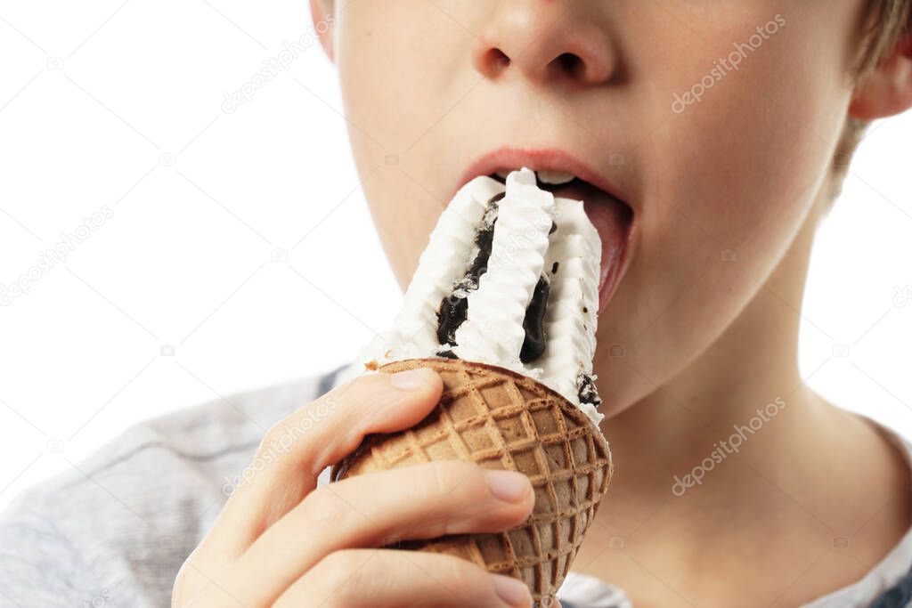 close-up boy eating ice cream isolated on white background