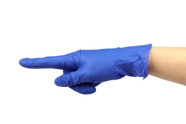 一只戴蓝色医用手套的手在白色背景上把食指指向侧面 — 图库照片