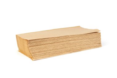 stack of paper napkins isolated on white background. brown napkins