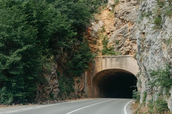 Empty route and small tunnel in mountain — Stock Photo, Image