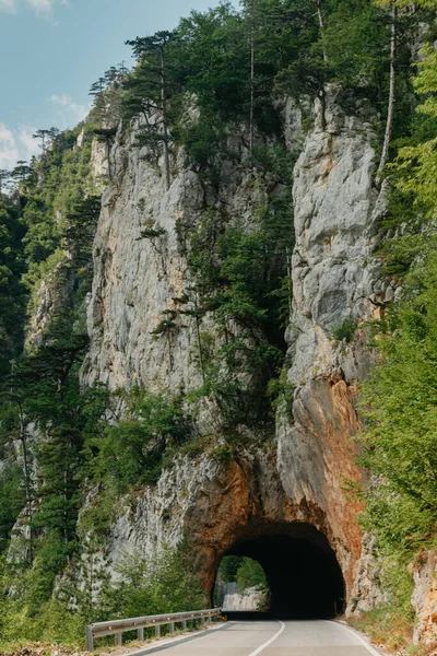 Empty route and small tunnel in mountain — Stock Photo, Image