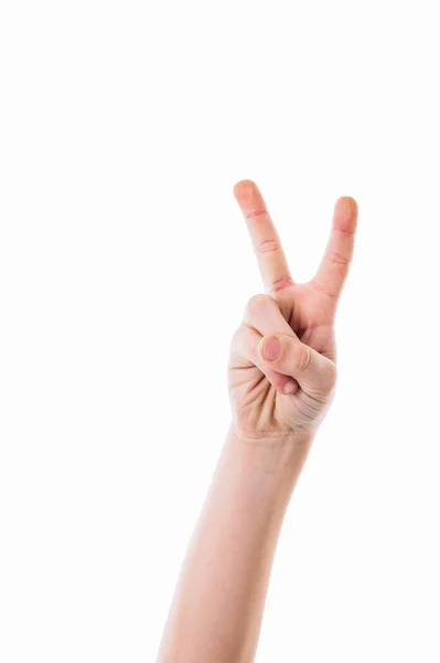 Isolated child hand shows the number two. Hand of caucasian young man showing fingers over isolated white background counting number 2 showing two fingers, gesturing victory and winner symbol — Foto de Stock
