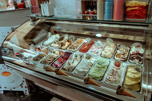 Various flavors of gelato icecream at the showcase display in dessert shop — Stock Photo, Image