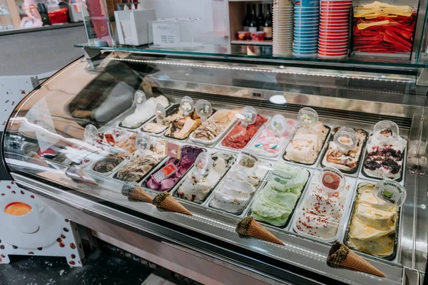 Various flavors of gelato icecream at the showcase display in dessert shop — Stock Photo, Image