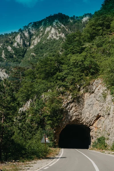 Empty route and small tunnel in mountain — Stock Photo, Image