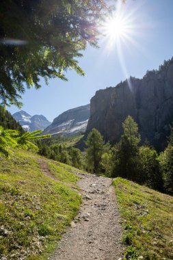 mountain trail panorama with shining sun