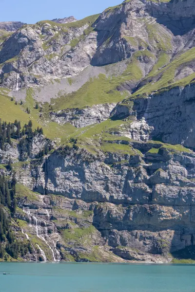 Oeschinen Lake Switzerland Alps Waterfalls Mountains Sky — Zdjęcie stockowe