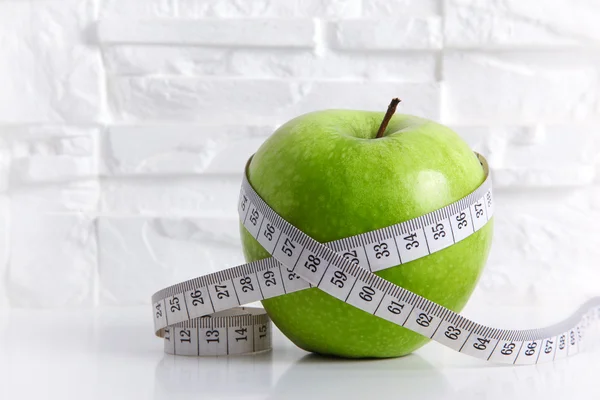 Green Apple with Measuring Tape Stock Image