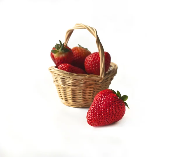 Strawberries in a little wicker basket — Stock Photo, Image