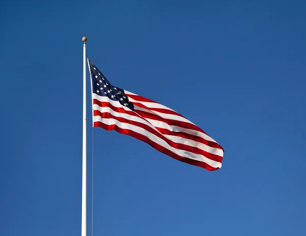 American flag waving on blue sly — Stock Photo, Image